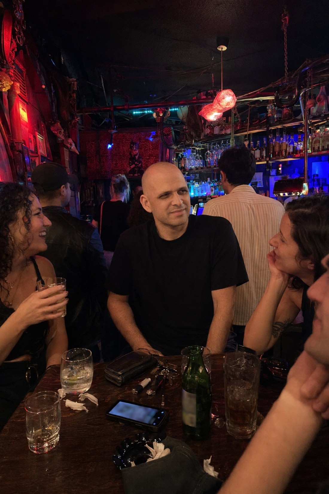 Man out with friends at a bar at night, a candid social AI photo for a dating profile