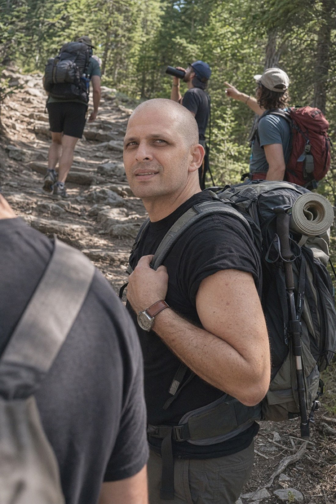 Man walking a quiet forest trail, the pace and volume where a sensitive woman's world opens up