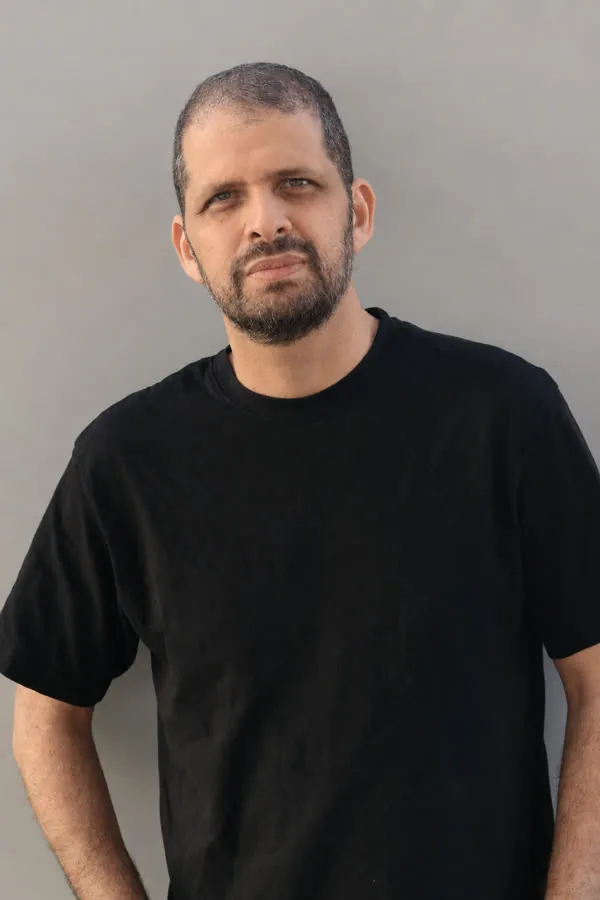 Reference photo: the same man, chin raised and head turned slightly