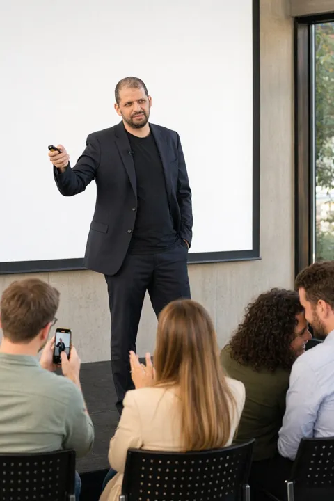 AI LinkedIn photo example: on stage with a microphone